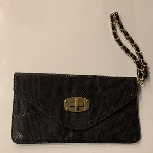 Black small sequince Bebe clutch with gold and black chain link strap